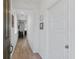 Bright hallway with natural light, wooden floors, and neutral walls at 3709 Neblina Dr, Henderson, NV 89052