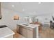 Modern kitchen boasts a large island with stainless steel appliances and an open floor plan at 3709 Neblina Dr, Henderson, NV 89052