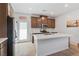 Modern kitchen with stainless steel appliances, a center island, and sleek countertops at 3709 Neblina Dr, Henderson, NV 89052