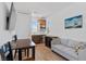 Living room with a table, couch, television, and a kitchenette at 3709 Neblina Dr, Henderson, NV 89052