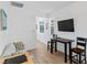 Bright living area with a dark dining table set and a comfortable sofa for seating at 3709 Neblina Dr, Henderson, NV 89052