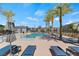 Inviting community pool with lounge chairs and lush landscaping, perfect for relaxing and enjoying the outdoors at 3709 Neblina Dr, Henderson, NV 89052