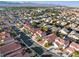 A high altitude aerial view shows the surrounding neighborhood and mountains in the distance at 4114 Jessica Marie St, North Las Vegas, NV 89032