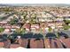 Neighborhood aerial view shows the well laid-out community with mature landscaping and mountain views at 4114 Jessica Marie St, North Las Vegas, NV 89032