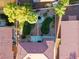 This aerial view shows the meticulously maintained backyard with a water feature and palm trees at 4114 Jessica Marie St, North Las Vegas, NV 89032