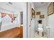 Bathroom featuring wood floors and vanity that compliments the matching framed mirror and artwork at 4114 Jessica Marie St, North Las Vegas, NV 89032