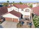 Beautiful two-story home with a terracotta roof, two-car garage, and well-maintained landscaping at 4114 Jessica Marie St, North Las Vegas, NV 89032