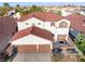 A home with a two-car garage and a charming front porch, perfect for relaxing at 4114 Jessica Marie St, North Las Vegas, NV 89032
