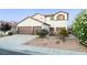 Charming two-story home with desert landscaping, a three-car garage, and a welcoming entrance at 4114 Jessica Marie St, North Las Vegas, NV 89032