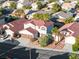 Home featuring a two-car garage, manicured landscaping, and a neutral color scheme at 4114 Jessica Marie St, North Las Vegas, NV 89032