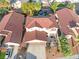 An aerial shows the home's two-car garage and an eye-catching backyard water feature at 4114 Jessica Marie St, North Las Vegas, NV 89032