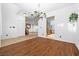 Living room has hardwood floors, chandelier, staircase in view, and an entry doorway to the kitchen at 4114 Jessica Marie St, North Las Vegas, NV 89032