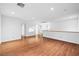 Bright, open loft space featuring wood floors, neutral walls, and a view of the hallway at 4114 Jessica Marie St, North Las Vegas, NV 89032