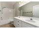 Bathroom featuring double sinks and a shower-tub combo, offering modern amenities at 432 Emerald Heights St, Las Vegas, NV 89144