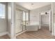A Primary bathroom featuring a glass enclosed shower and separate tub at 432 Emerald Heights St, Las Vegas, NV 89144