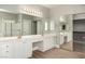 A modern bathroom with double sinks, vanity, and glass shower at 432 Emerald Heights St, Las Vegas, NV 89144