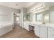 A bright and spacious bathroom with double sinks and a separate tub at 432 Emerald Heights St, Las Vegas, NV 89144