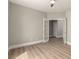 A bright bedroom with wood-look floors and charming French doors at 432 Emerald Heights St, Las Vegas, NV 89144