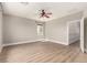 A well-lit bedroom with wood-look floors and a ceiling fan at 432 Emerald Heights St, Las Vegas, NV 89144