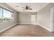 A spacious bedroom featuring wood-look floors and large windows at 432 Emerald Heights St, Las Vegas, NV 89144