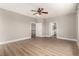 A bright bedroom featuring wood-look floors and easy access to a bathroom at 432 Emerald Heights St, Las Vegas, NV 89144