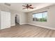 An airy bedroom featuring wood-look floors and a ceiling fan at 432 Emerald Heights St, Las Vegas, NV 89144