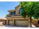 Two-story home features a three-car garage and covered porch at 432 Emerald Heights St, Las Vegas, NV 89144