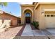 Two-story home features a grand entrance and desert landscaping at 432 Emerald Heights St, Las Vegas, NV 89144
