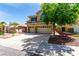 Two-story home with a three car garage and low maintenance desert landscaping at 432 Emerald Heights St, Las Vegas, NV 89144