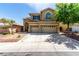 Charming two-story home with a three car garage and low maintenance desert landscaping at 432 Emerald Heights St, Las Vegas, NV 89144