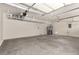Spacious two car garage featuring overhead storage racks and water heater at 432 Emerald Heights St, Las Vegas, NV 89144