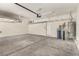 Spacious two car garage featuring overhead storage racks, water heater, and water filter at 432 Emerald Heights St, Las Vegas, NV 89144