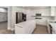 Stylish kitchen with stainless steel appliances, a large island, and ample cabinet space at 432 Emerald Heights St, Las Vegas, NV 89144