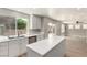 Well-lit kitchen featuring a center island, stainless appliances, and convenient backyard access at 432 Emerald Heights St, Las Vegas, NV 89144