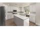 Modern kitchen with white cabinets, stainless steel appliances, and a large center island at 432 Emerald Heights St, Las Vegas, NV 89144