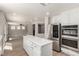 Beautiful kitchen offering a functional island, modern appliances, and seamless living room integration at 432 Emerald Heights St, Las Vegas, NV 89144