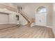 Bright living room boasts soaring ceilings, wood staircase, and an elegant chandelier at 432 Emerald Heights St, Las Vegas, NV 89144