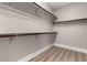 Spacious walk-in closet with built-in shelving and hanging rods, offering ample storage at 432 Emerald Heights St, Las Vegas, NV 89144