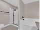 Modern bathroom featuring a glass shower and a soaking tub with white tiling and contemporary fixtures at 4324 W Lake Mead Blvd # 202, Las Vegas, NV 89108