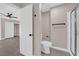 Bathroom featuring shower with glass doors, toilet, and closet with sliding doors at 4324 W Lake Mead Blvd # 202, Las Vegas, NV 89108