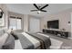 Bright bedroom featuring a window, ceiling fan, and wood-look floors at 4324 W Lake Mead Blvd # 202, Las Vegas, NV 89108