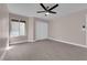 Neutral bedroom with a ceiling fan, window with blinds, gray flooring and a closet with sliding doors at 4324 W Lake Mead Blvd # 202, Las Vegas, NV 89108