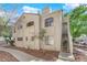 Exterior side view of a two-story condo building with stucco and desert landscaping at 4324 W Lake Mead Blvd # 202, Las Vegas, NV 89108