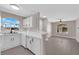 Open kitchen and living area featuring a breakfast bar, modern finishes, and natural light at 4324 W Lake Mead Blvd # 202, Las Vegas, NV 89108