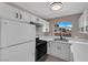 Kitchen with white cabinets, modern appliances, and a bright window over the sink at 4324 W Lake Mead Blvd # 202, Las Vegas, NV 89108