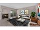 Cozy living room with fireplace, plush seating, and sliding door access to outdoor space at 4324 W Lake Mead Blvd # 202, Las Vegas, NV 89108