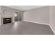 Bright living room featuring a fireplace, sliding glass door, and wood-look flooring at 4324 W Lake Mead Blvd # 202, Las Vegas, NV 89108