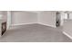Open-concept living room with modern flooring, fireplace and access to laundry area at 4324 W Lake Mead Blvd # 202, Las Vegas, NV 89108