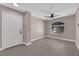 Bright living room with a large window, ceiling fan, and neutral walls and floors providing a cozy and inviting space at 4324 W Lake Mead Blvd # 202, Las Vegas, NV 89108