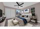 Comfortable main bedroom with a ceiling fan, wardrobe, and stylish decor at 4324 W Lake Mead Blvd # 202, Las Vegas, NV 89108